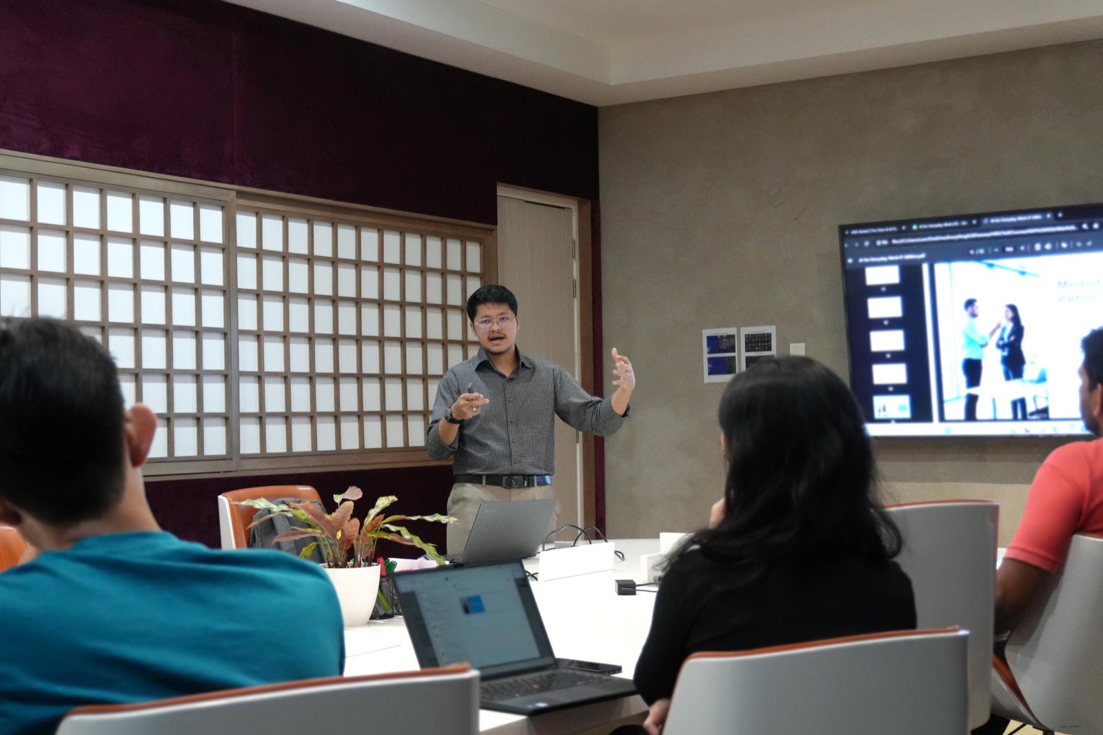 An AI Boost Center training session in a client boardroom
